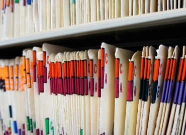 shelf of filed medical folders