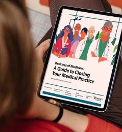 woman viewing an online version of A Guide to Closing Your Medical Practice