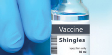 shingles vaccine in a blue gloved hand
