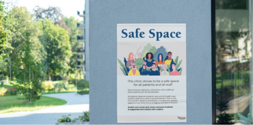 Safe spaces poster on building