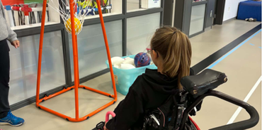 girl playing wheelchair basketball