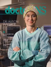 Dr. Alison Wallace wearing scrub gown and cap on the cover of the November 2022 edition of the doctorsNS magazine