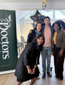 Physician Leadership Development program graduates with facilitator