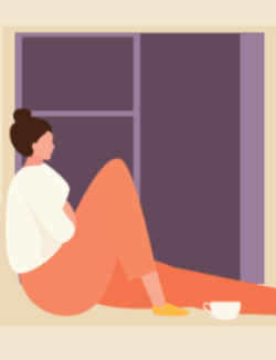 woman sitting on a window seat staring out the window