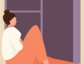 woman sitting on a window seat staring out the window