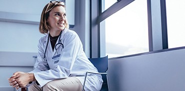 Young female physician sitting