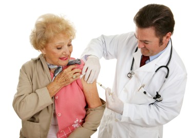 senior woman receiving a flu shot