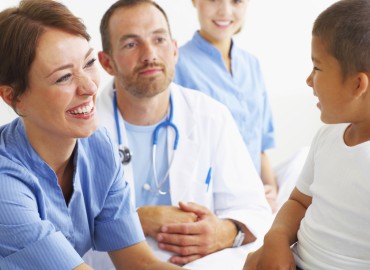image of physicians with a young male patient