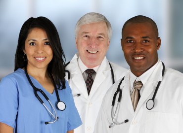 image of three health care professionals. one female and two males