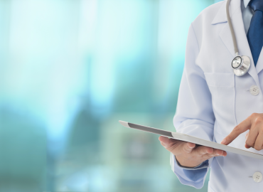 healthcare worker holding a tablet