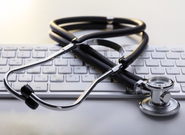 A stethoscope on keyboard