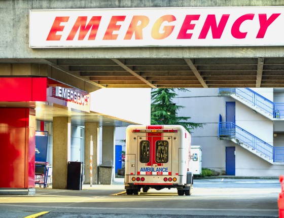 image of an ambulance at a hospital emergency entrance