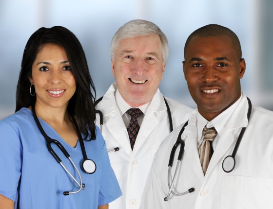 image of three health care professionals. one female and two males