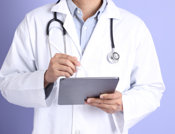 physician holding a tablet 