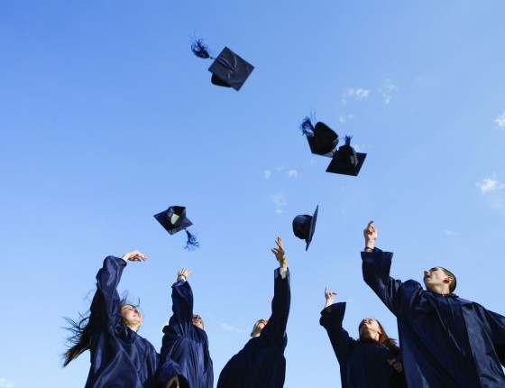 Graduates tossing caps