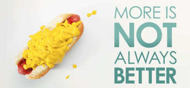 A hot dog with too much mustard